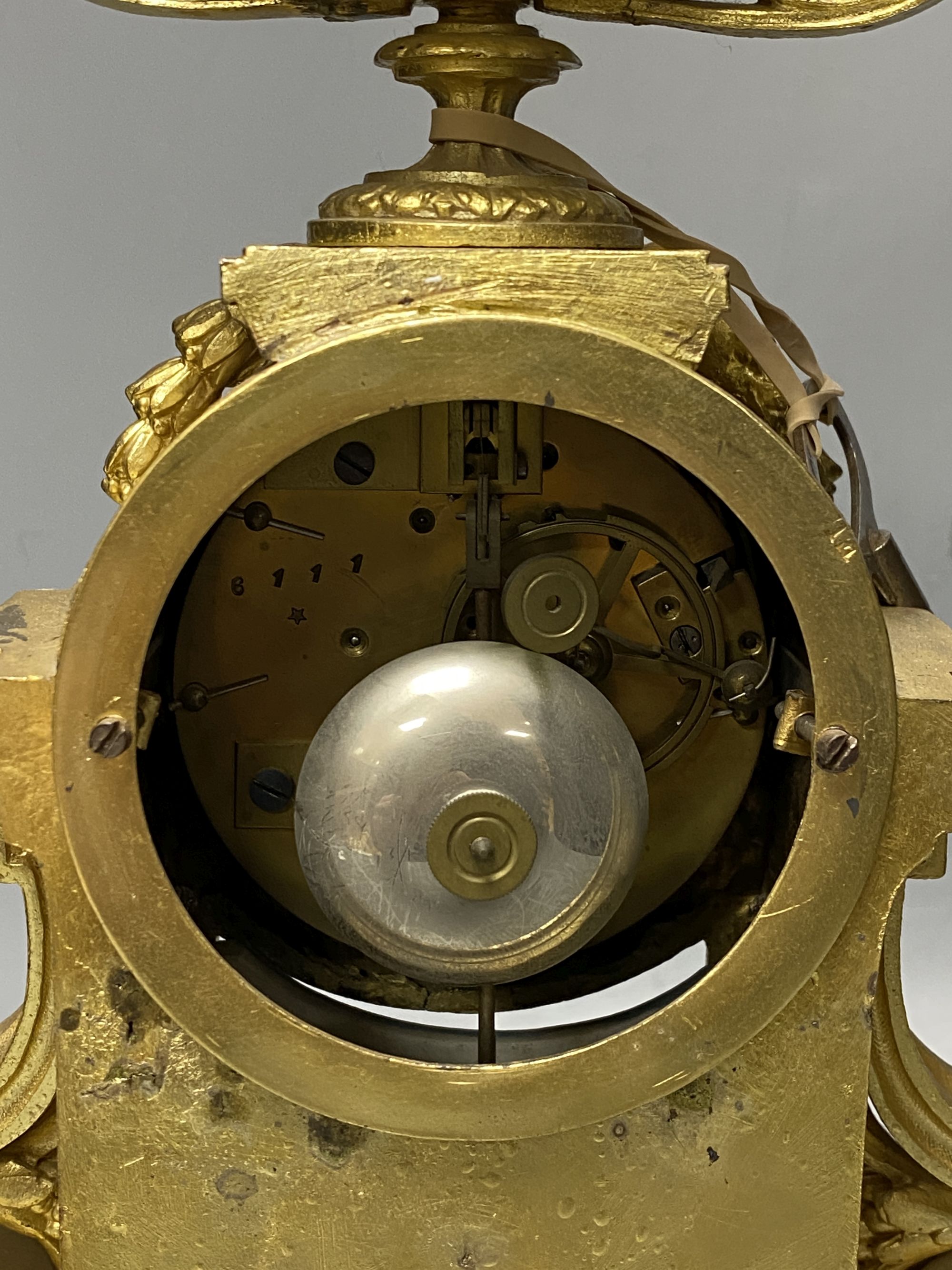 A Louis XVI style gilt spelter mantel clock inset Sevres style panels, height 38cm